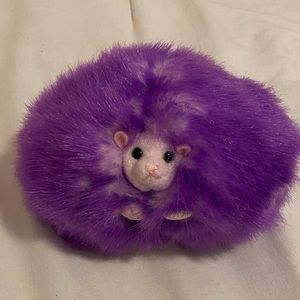 Purple Harry Potter Pygmy puff. Makes noise just like in the movies!